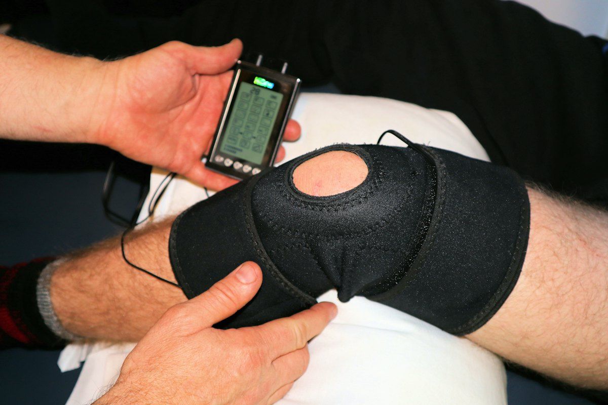 Physiotherapist guiding a patient through treatment